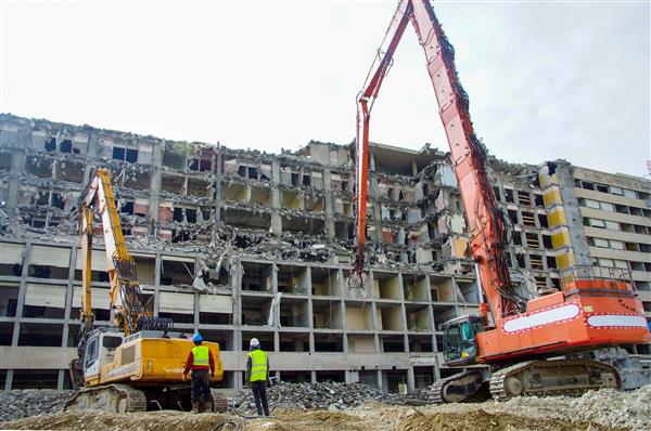 demolition team tearing down structure