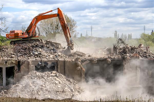 demolition team demolishing concrete slabs